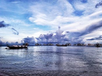 Scenic view of sea against cloudy sky