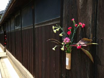 Flowers on wooden wall