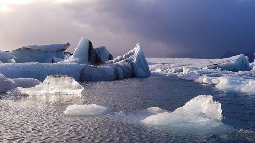 Frozen lake against sky