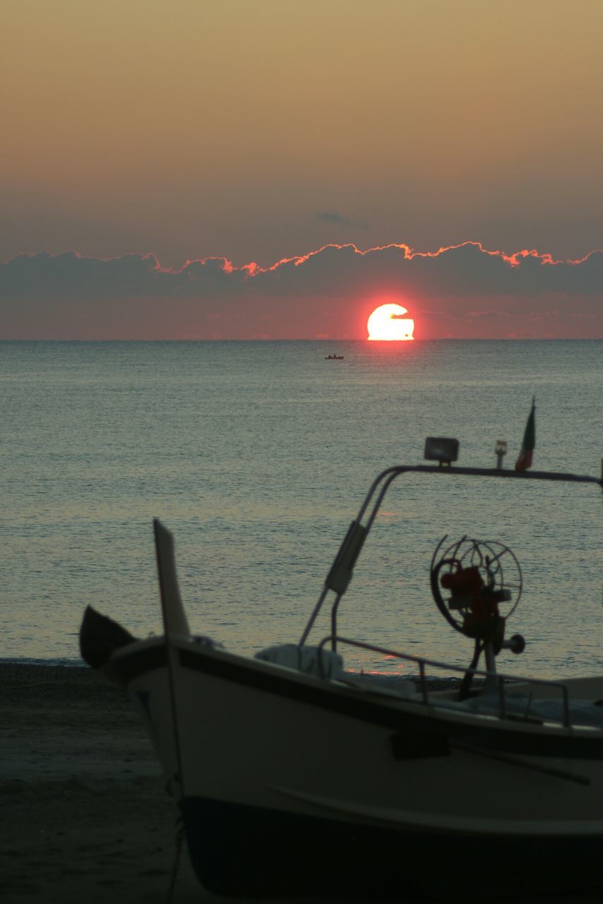 water, sea, sunset, transportation, mode of transport, nautical vessel, horizon over water, scenics, tranquil scene, sky, boat, beauty in nature, tranquility, sun, nature, silhouette, idyllic, beach, orange color, outdoors