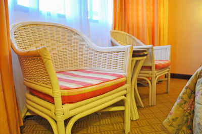 Close-up of chair by table at home