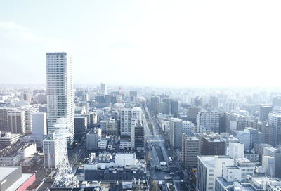 Aerial view of cityscape against sky