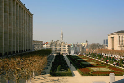 View of buildings against clear blue sky