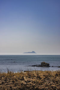 Scenic view of sea against clear sky