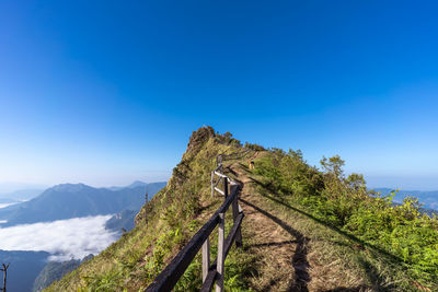 Scenic view of mountains against clear blue sky