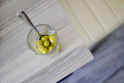 Close-up of garlic on wooden table