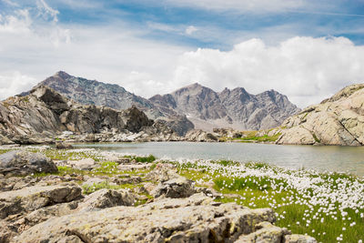 Scenic view of lake and mountains against sky