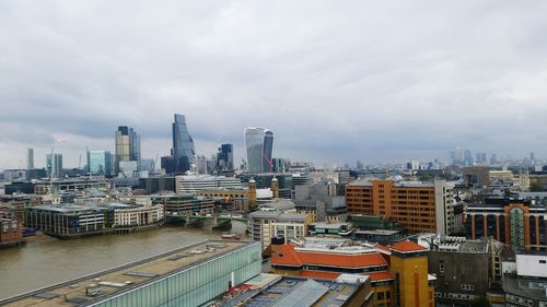 High angle view of cityscape against cloudy sky