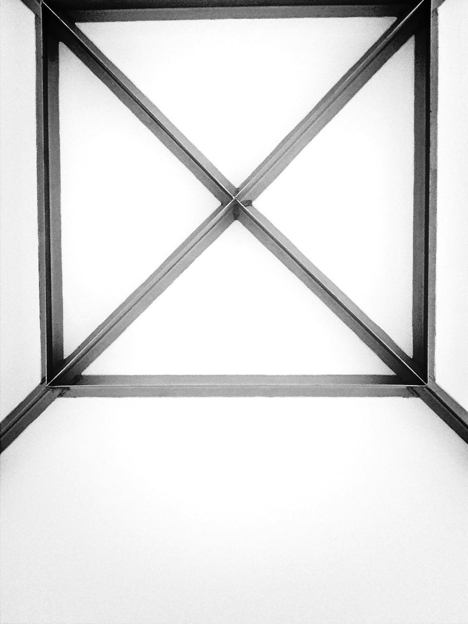 indoors, pattern, low angle view, window, geometric shape, built structure, architecture, full frame, metal, glass - material, backgrounds, directly below, design, copy space, ceiling, no people, close-up, transparent, clear sky, day