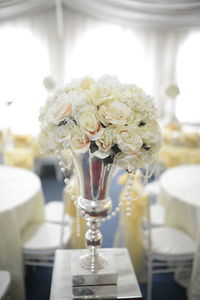 Close-up of white flower vase on table