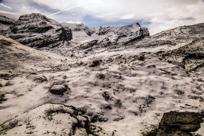 Scenic view of snowcapped mountains against sky