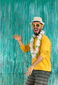 Portrait of smiling man standing in sea