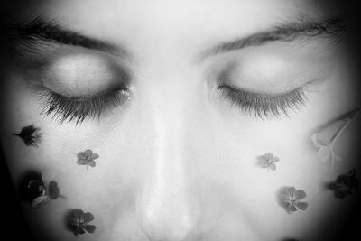 Close-up portrait of woman with eyes closed