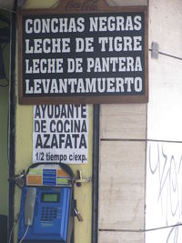 Close-up of sign board at subway station