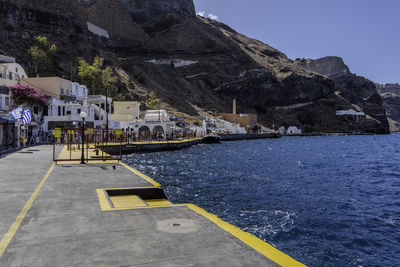 Santorini, greece, may 4, 2024. view of the port of fira with its shops.