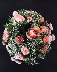 Close-up of rose bouquet against black background