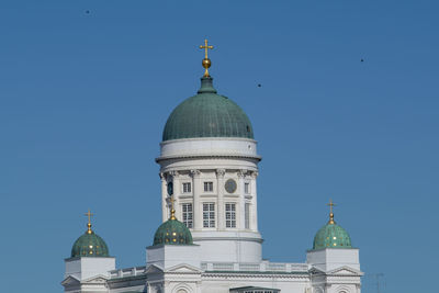 Low angle view of building against clear blue sky