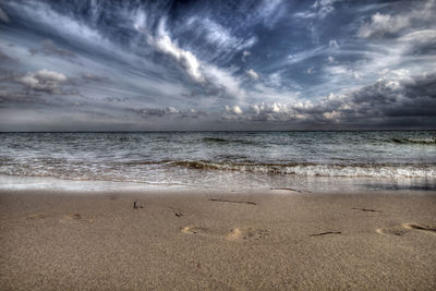 Scenic view of beach against sky