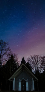 Low angle view of building against sky at night