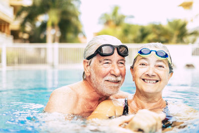 Portrait of smiling man in swimming pool