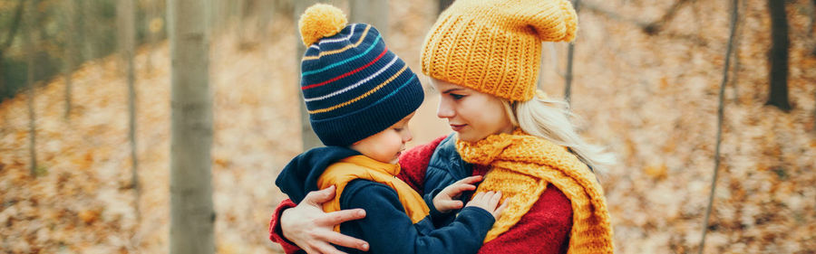 Mother and son in park during winter