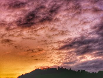 Scenic view of dramatic sky during sunset