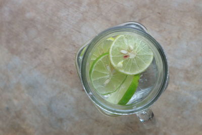 High angle view of lemon in glass on table