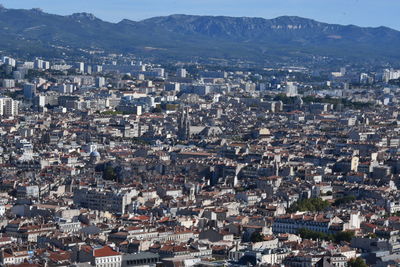 High angle view of townscape against mountains