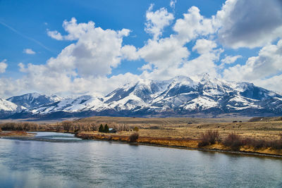 Scenic view of snowcapped mountains against sky