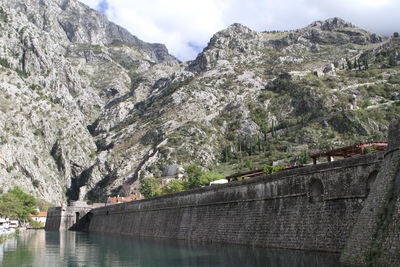 Scenic view of river amidst mountains