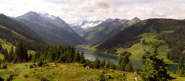 Scenic view of mountains against cloudy sky