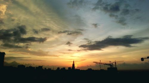 Silhouette of built structure at sunset