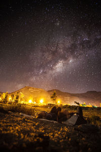 Young couple watching milky way