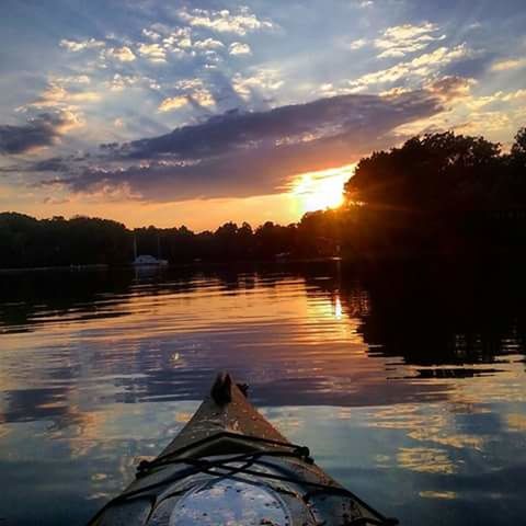 SCENIC VIEW OF LAKE AT SUNSET