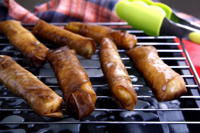 Close-up of meat on barbecue grill