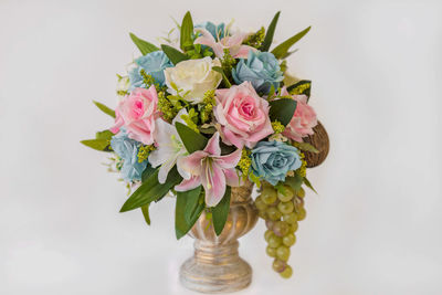 Close-up of rose bouquet against white background