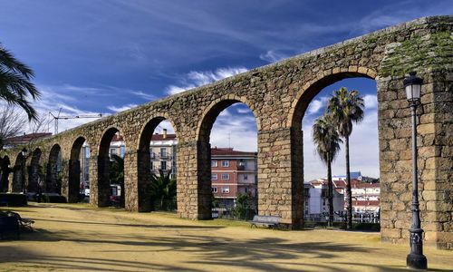 View of bridge against cloudy sky