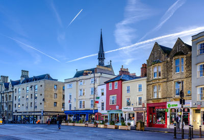 Buildings in city against sky