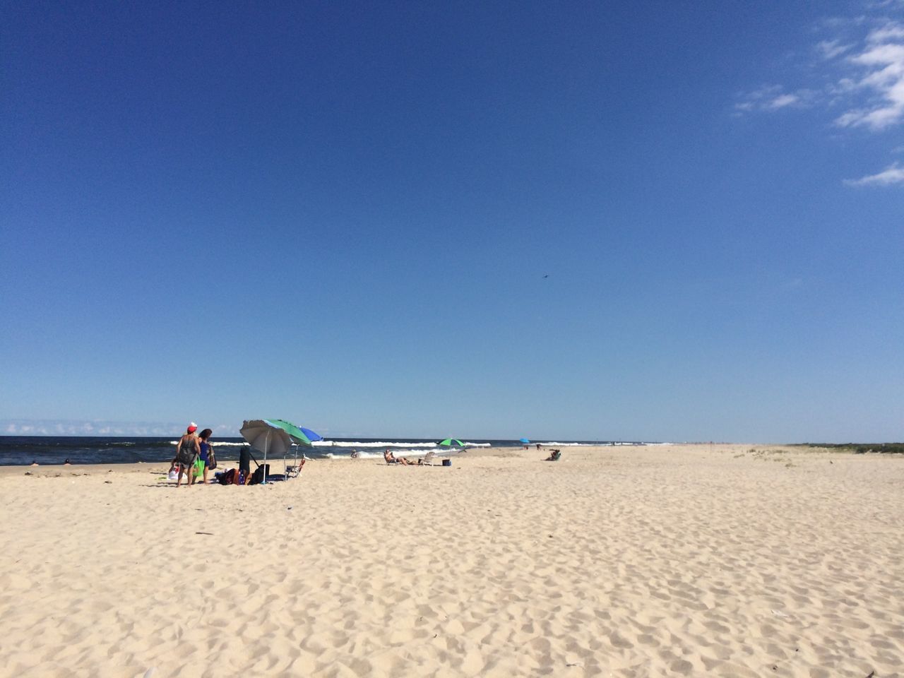 sand, beach, sea, shore, clear sky, copy space, blue, tranquility, vacations, tranquil scene, horizon over water, summer, sunlight, nature, sky, water, scenics, incidental people, day, beauty in nature