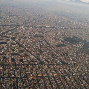 High angle view of city buildings against sky