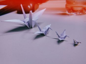 Close-up of bird origami on table