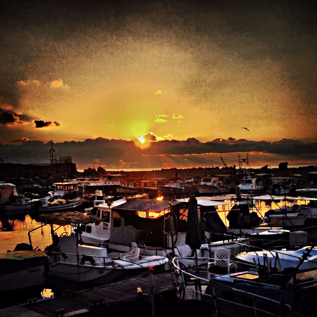 sunset, nautical vessel, moored, water, orange color, boat, transportation, mode of transport, harbor, sun, sky, sea, reflection, cloud - sky, nature, scenics, mast, beauty in nature, outdoors, sailboat