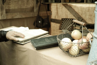 Close-up of hand holding food on table