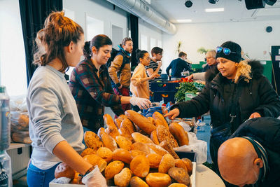 Group of people standing in market