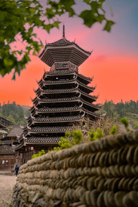 Low angle view of temple against sky during sunset