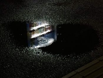 High angle view of wet road at night