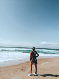 One girl standing in the beach of praia de adraga