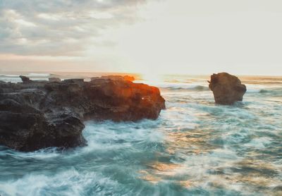 Scenic view of sea at sunset