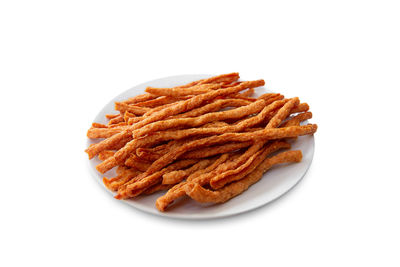 Close-up of food in plate on white background