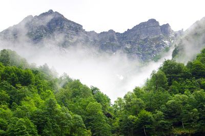 Low angle view of waterfall against mountain